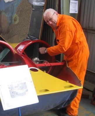 Volunteer making finishing touches to a hovercraft